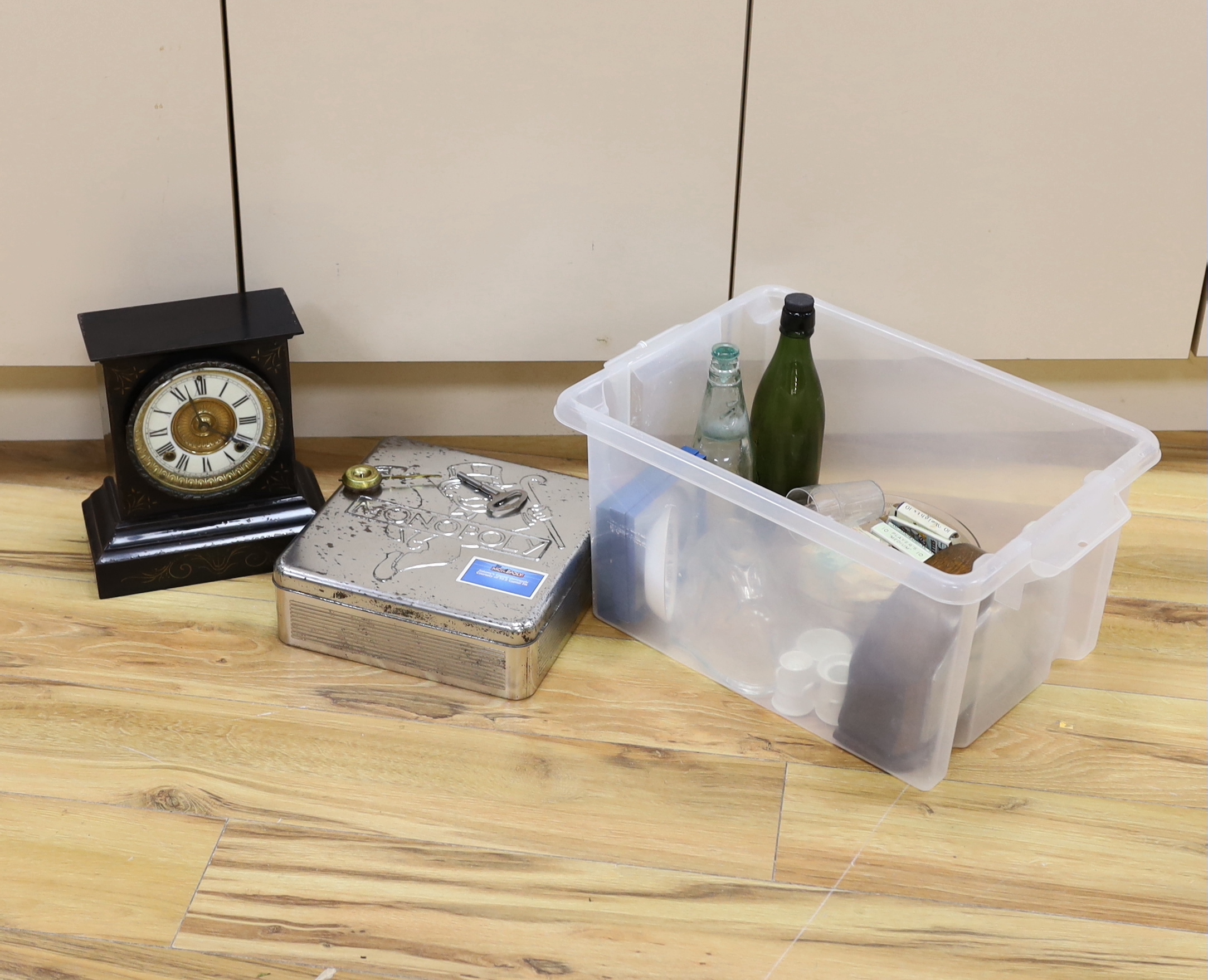 A black slate clock, tinned Monopoly game, old bottles, cigarette boxes and mixed collectables